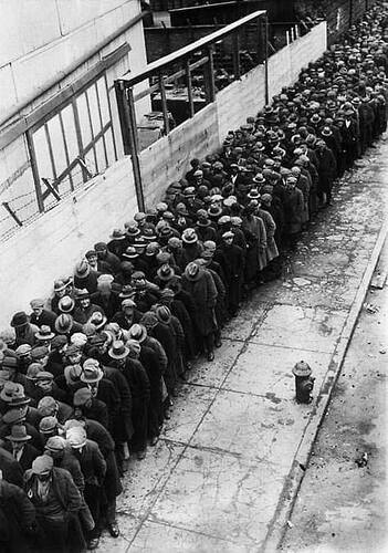 Men waiting in a line for the possibility of a job during the Great Depression