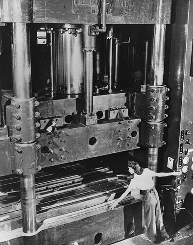 Lydia Martinez, aged 19, operates a hydro press that develops pressure up to 4,500 tons and speeds production of parts for Consolidated Aircraft's B-24 Liberators, PBY Catalinas, and PB2Y Coronados, 1942.