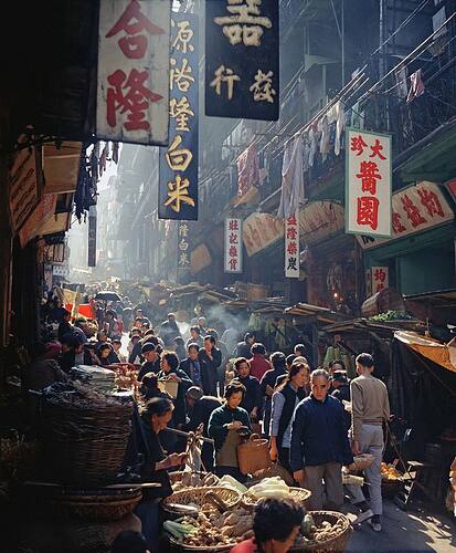 Street in Hong Kong, 1950s. Photo by Fan Hȯ.