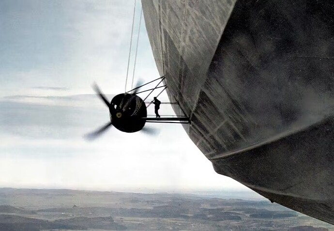 The zeppelin era peaked with Hindenburg. A mechanic checks an engine during a 1936 flight.