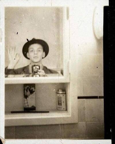 Selfies are ubiquitous today, but they've been popular for decades. Here, a 23-year-old Frank Sinatra snaps a bathroom selfie in 1938