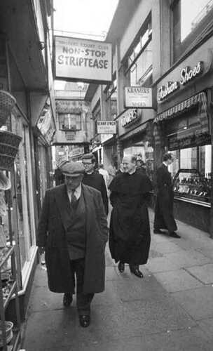 A couple of Catholic Priests enjoying the red light district of soho in 1960s London