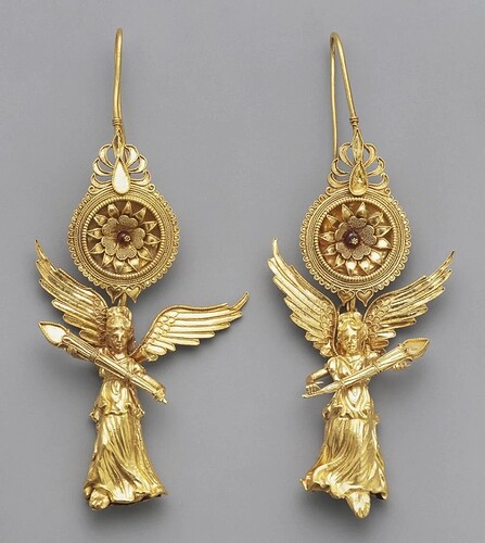 A pair of gold earrings depicting the goddess Nike, crafted around 225-175 BC during the Hellenistic period. Adorned with glass inlays, these intricate pieces are part of The J. Paul Getty Museum collection