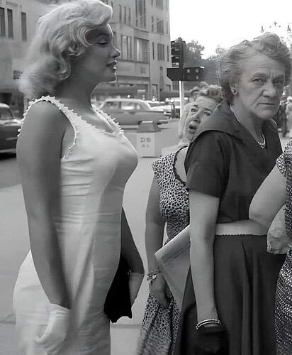 Marilyn Monroe in line for a hot dog, New York, 1957