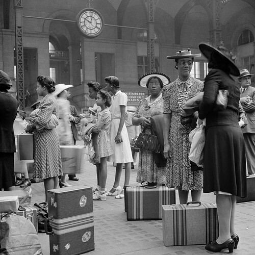 Passengers waiting for their trains at the Pennsylvania railroad station, New York City (1942)