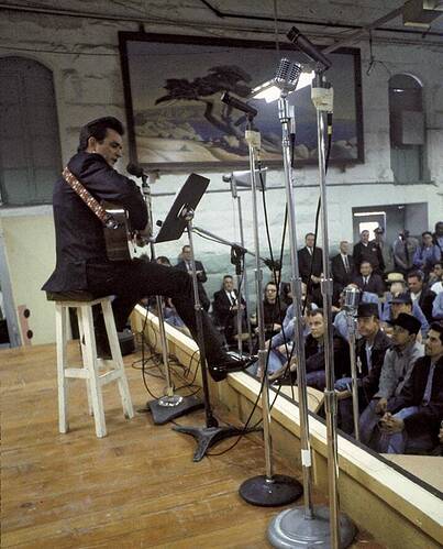 Johnny Cash settles in to perform during his famous Folsom Prison concert on Jan. 13, 1968