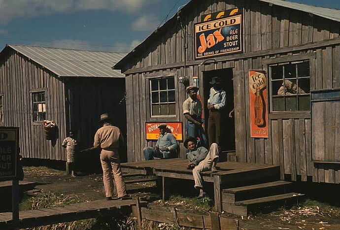 The living quarters and the juke joint in a migrant worker camp in Belle Glade, Florida during the Great Depression. (1930s)