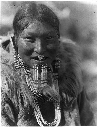 Kenowun, an Inuit woman wearing jewelry. Nunivak Island, Alaska, 28 February 1929