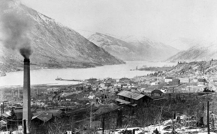 History A fabulous early shot of historic Nelson, BC showing the short lived smelter on the left and the old sternwheeler wharf jutting out into the narrow West Arm of Kootenay Lake around 1900