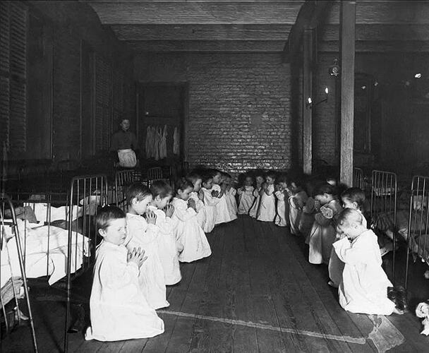 Prayer time in the nursery (Five Points House of Industry, New York. Photo by Jacob Riis, ca. 1889)