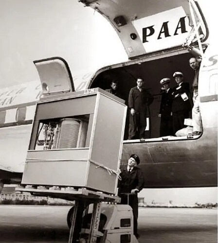 A 5MB IBM hard drive being loaded onto an airplane in 1956. This early data storage device, weighing over 2,000 pounds, marked a groundbreaking step in computing