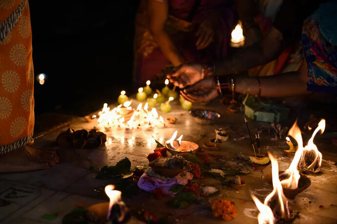 A file photo shows people lighting candles for a Hindu religious ceremony during a Dev Diwali festival in Varanasi, India. / Credit: Getty/iStockphoto