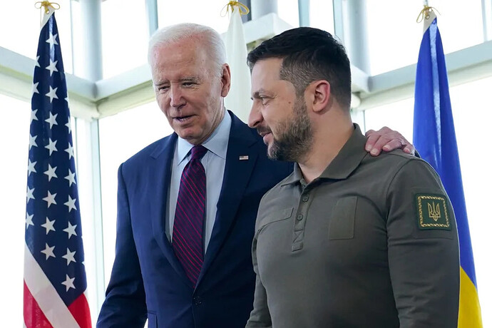 President Joe Biden, left, walks with Ukrainian President Volodymyr Zelenskyy ahead of a working session on Ukraine during the G7 Summit in Hiroshima, Japan, Sunday, May 21, 2023.