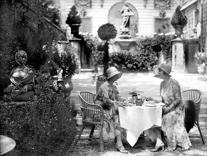 Ladies meet for tea in the Paris Hotel Ritz garden in 1930