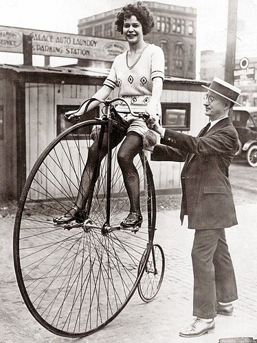 Woman on a Victorian-era bicycle on July 17, 1922 in Chicago