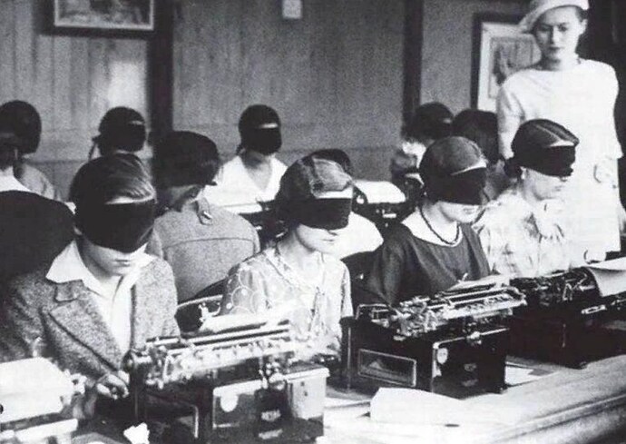 Typists take on a blind typing challenge at a prestigious typewriter competition in Paris. (1940)