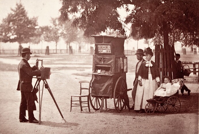 A street photographer at work on Clapham Common, London, with a mobile booth. England, 1870s
