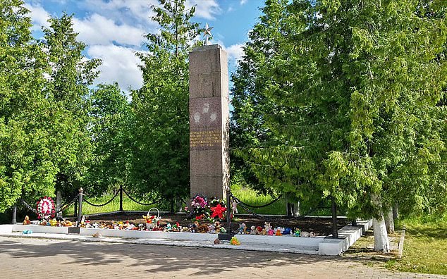 One theory is that the younger remains were from a notorious nearby concentration camp where at any one time 300-plus children were incarcerated solely to supply blood for wounded German soldiers. Pictured: A memorial to the child victims of the Vyritsa camp