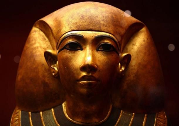Shining golden Egyptian funeral mask.