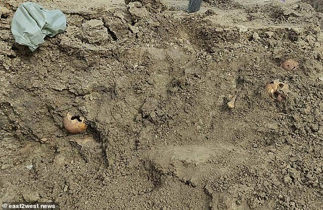 The first hint of a mass grave came to light when the remains of two adults and a newborn child were found a year ago during a land survey