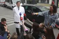 Dr. Milika Asanin, head of Serbia Clinical Centre hospital talks to media in Belgrade, Serbia, Wednesday, May 3, 2023. Serbian police say a teenage boy opened fire at a school in central Belgrade, killing several children and hospitalizing several more. (AP Photo/Milos Miskov)