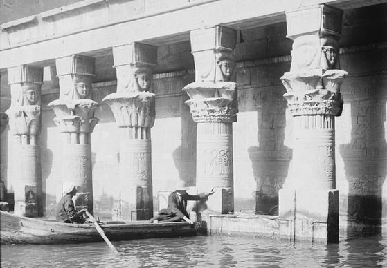 The Temple of Isis at Philae, Egypt, flooded during the early 20th century, captured here between 1900 and 1920. The temple, once an important site for ancient worship, stands partially submerged
